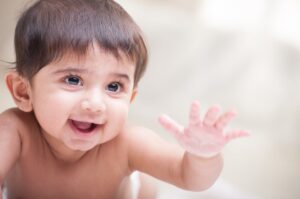 Baby reaching their hand out